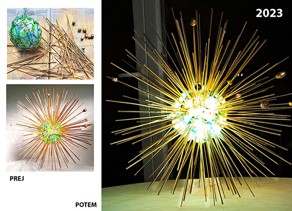 bleščeč okras, kot nebesno telo. Krogla iz stiroporja, ovita z lučkami na baterije, v katero so zapičene zlato pobarvane lesene paličice