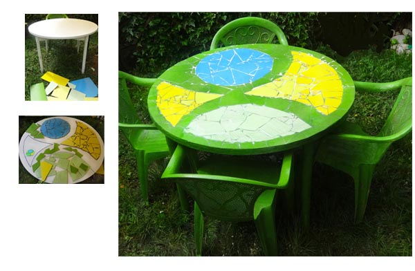 Lesena bela miza nadgrajena z mozaikom iz razbitih keramičnih ploščic.